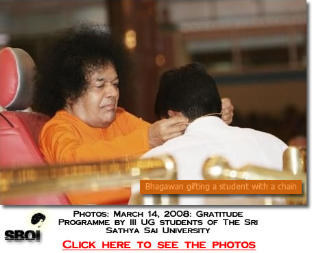 Sai Baba gifting a student with a chain - 14th March 2008 - SBOI - Sai Baba Of India 